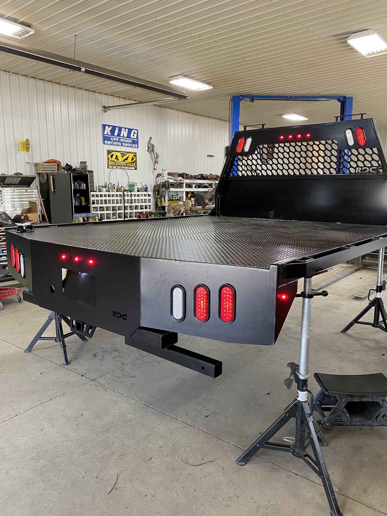 Custom flatbed with hex-mesh headache rack and LED lighting